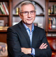 Doug Portrait Office Standing Cropped 2022.pptx